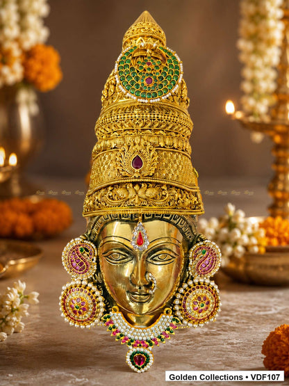 Fully Decorated Brass Varalakshmi Face with Nakshi Crown and Pink Jadau Earrings shown in a Varalakshmi Vratham pooja setting
