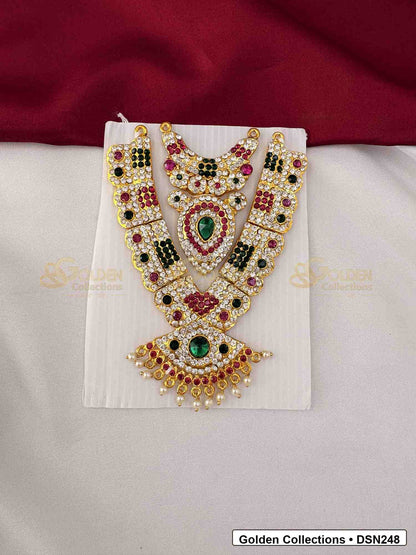 Front view of Goddess Idol Wide Short Necklace with Green Pink Stones showing wider chest-style short necklace with layered pearl-like rows, green and pink center stones and gold-tone finish