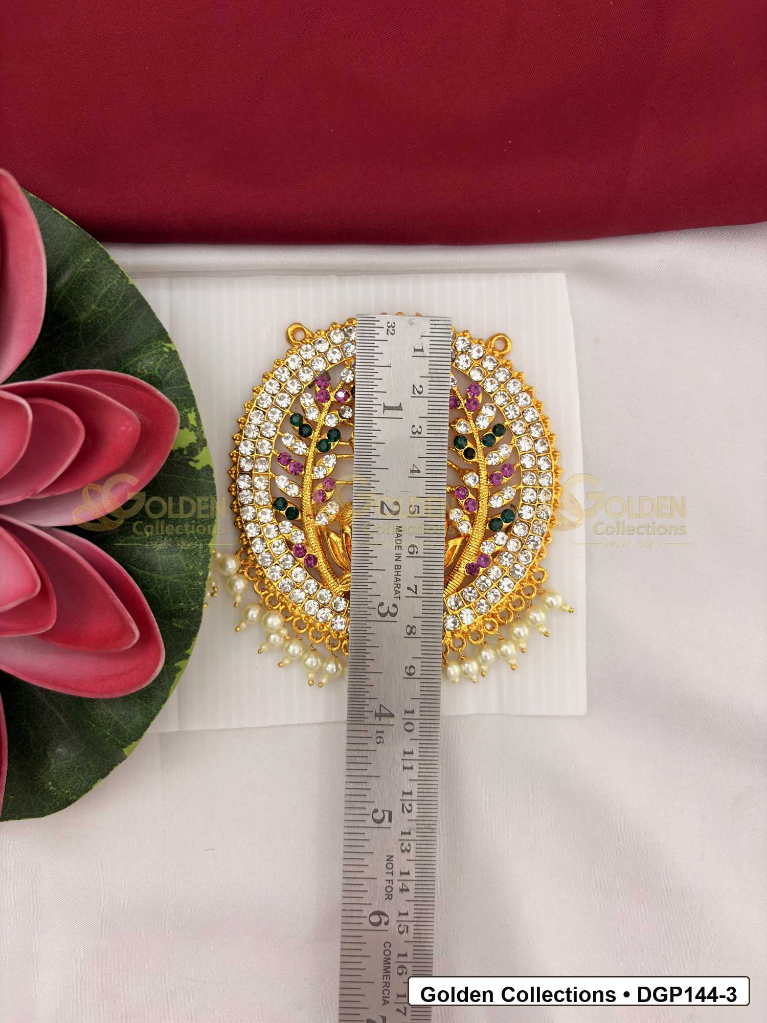 Measurement photo showing 4 x 3.25 Inches goddess motif round deity pendant for idol alankaram with ruler for idol alankaram