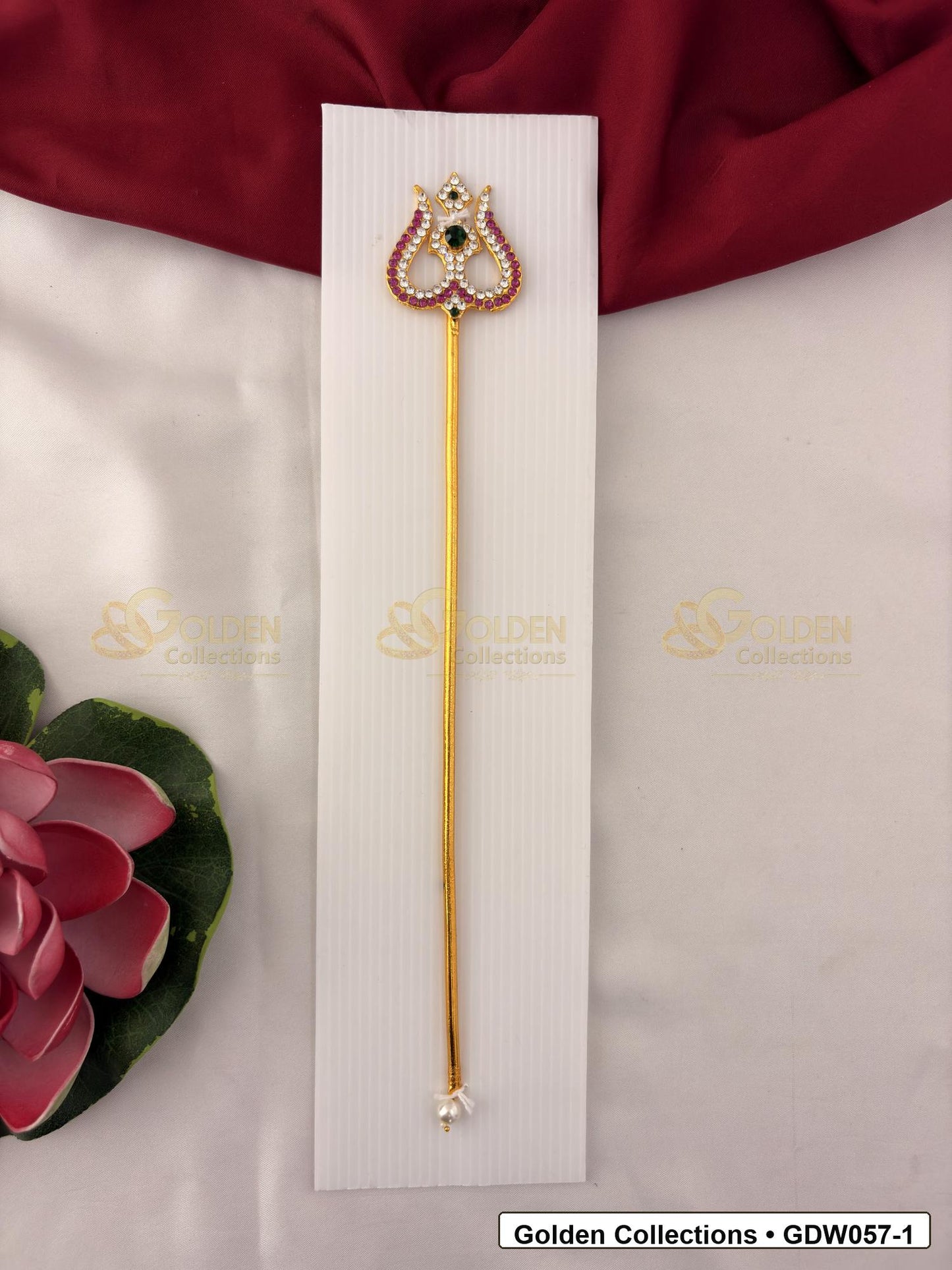 Gold-Tone Trishul for Idol Alankaram front view showing slender gold-tone trishul accessory with clear stone border, small green accent and pearl-style tip detail for idol alankaram