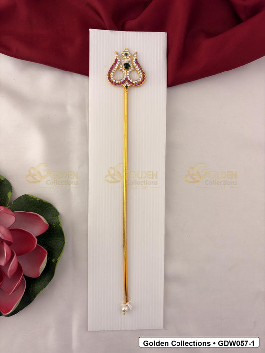 Gold-Tone Trishul for Idol Alankaram front view showing slender gold-tone trishul accessory with clear stone border, small green accent and pearl-style tip detail for idol alankaram