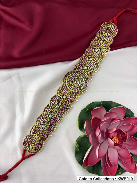 Angled product view of Green Red Stone Real Kemp Vaddanam Waist Belt from Golden Collections