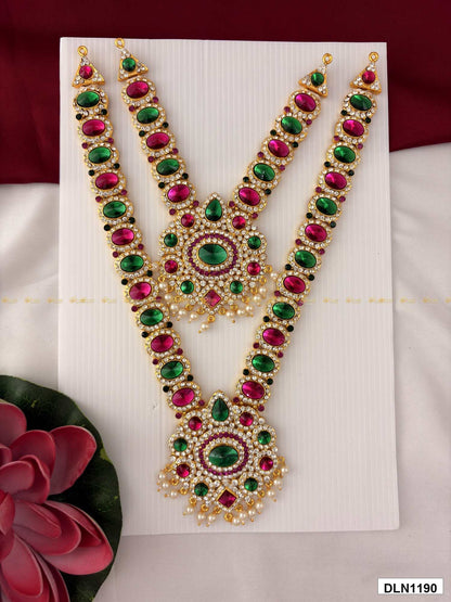 Front view of deity long haram set with multicolor stones and gold plating for idol alankaram