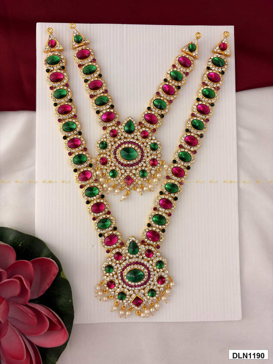 Front view of deity long haram set with multicolor stones and gold plating for idol alankaram