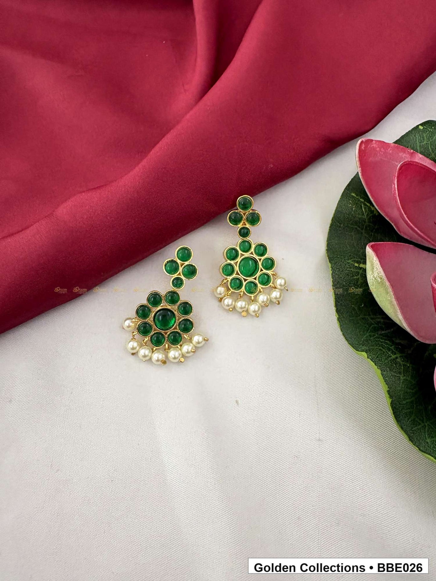 Angled product view of Green Stone Real Kemp Jhumki Earrings from Golden Collections