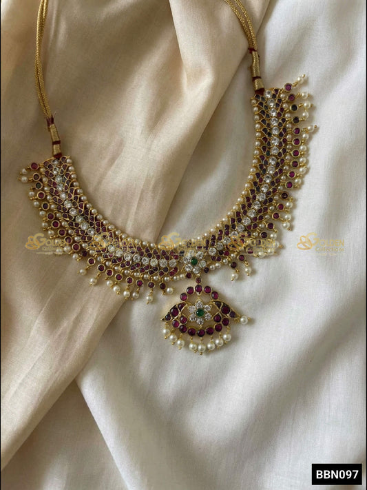 GoldenCollections Kemp Bharatanatyam Short Necklace (Attigai) – front view with ruby kemp stones and pearl drops
