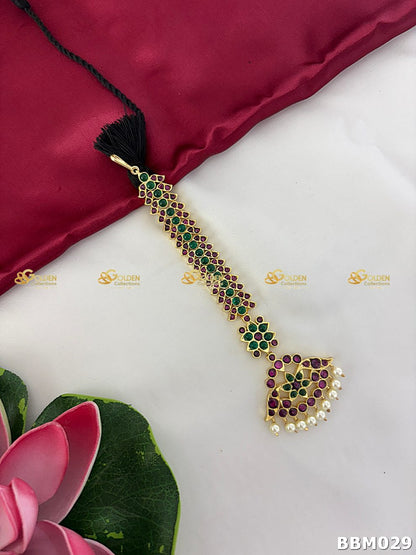 Long temple-style Kemp maangtikka with red and green stones and pearl hangings for Bharatanatyam Arangetram