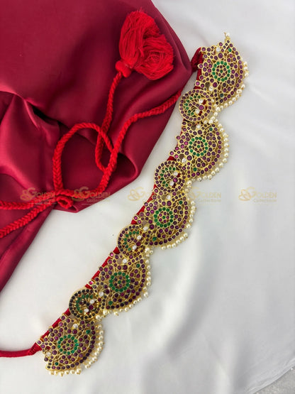 Golden Collections Kemp Petal Design Vaddanam - Front view showcasing intricate ruby and emerald kemp stones with pearl drops.