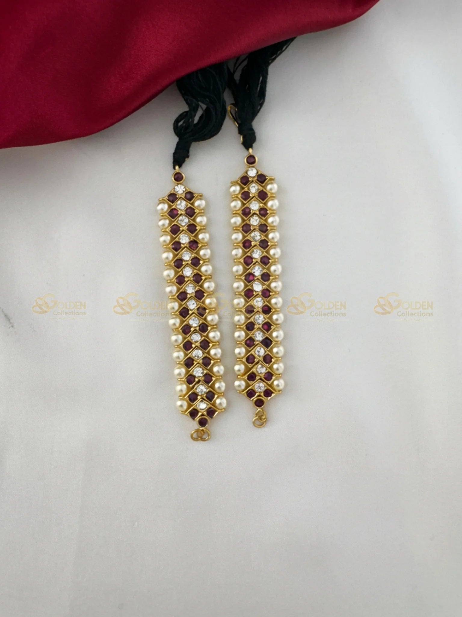 Golden Collections Kemp Glistening Pearl Drop Mattal - Front close-up view showing the intricate arrangement of maroon and white stones with pearl drops.