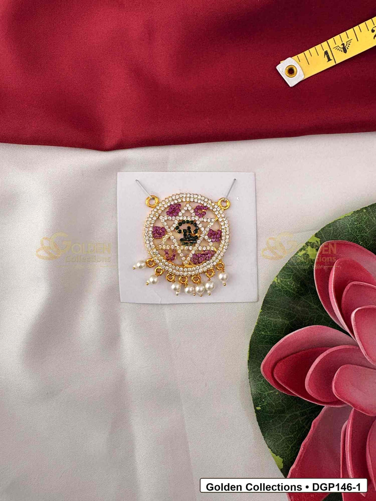 Om Motif Round Deity Pendant for Idol Alankaram front view showing round Om motif deity pendant with red and clear stone work, pearl-style bead edge and gold-tone setting for idol alankaram
