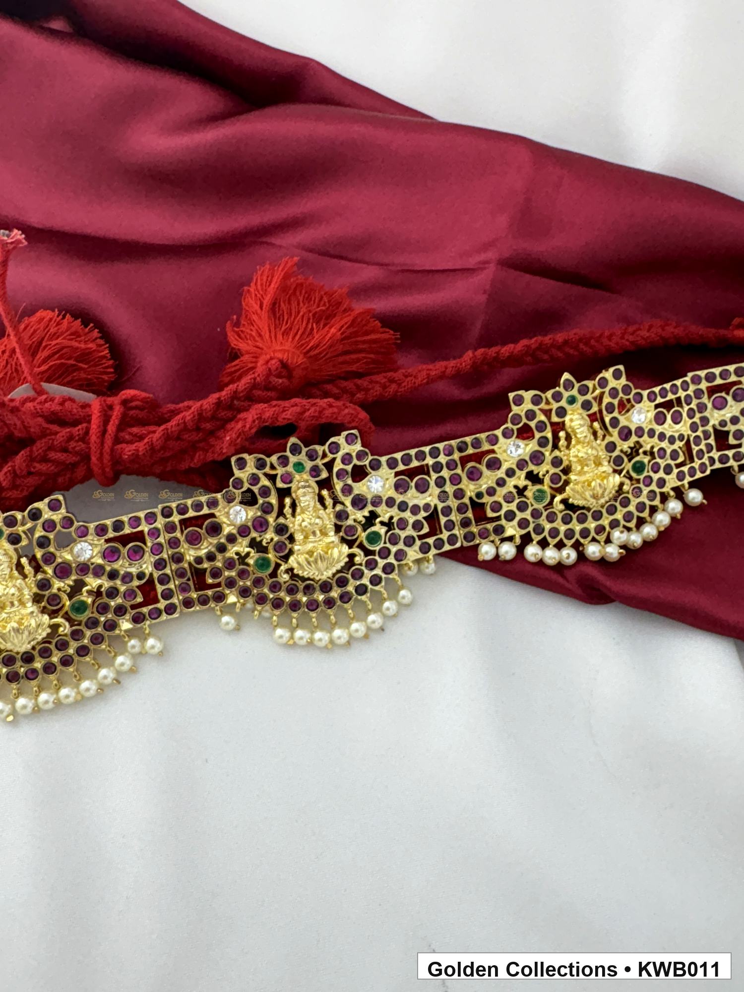 Angled product view of Ornate Linked Real Kemp Vaddanam Waist Belt from Golden Collections