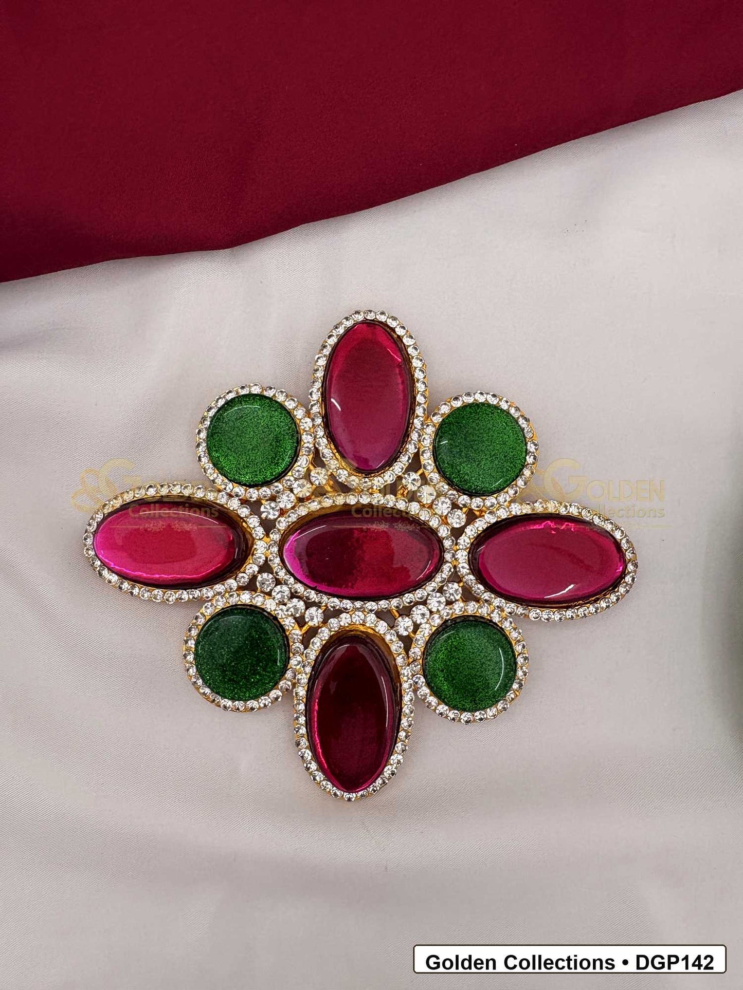 Oval Stone Deity Pendant for Idol Alankaram front view showing oval stone deity pendant with pink and green stones, clear stone border and gold-tone setting for idol alankaram