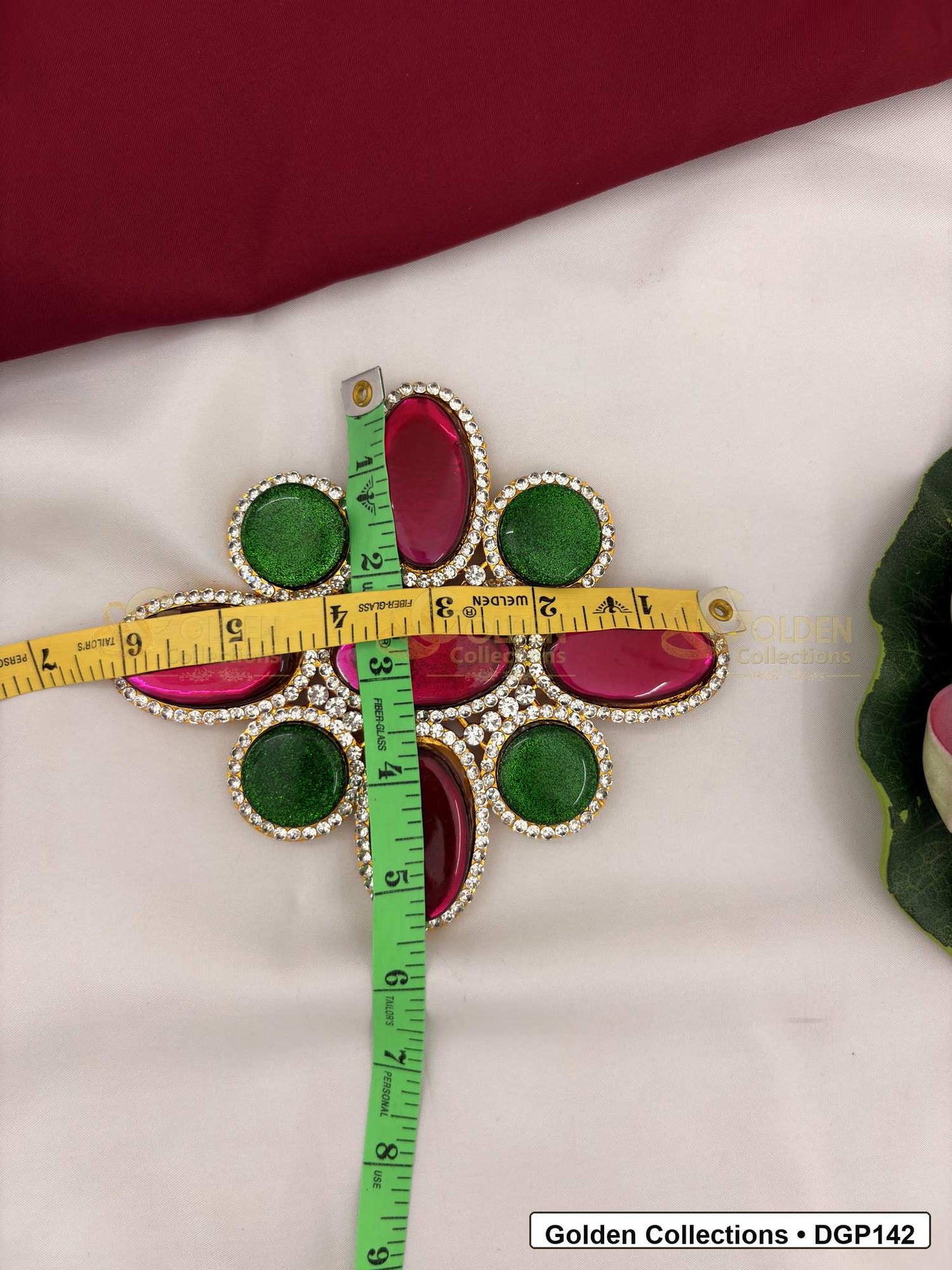 Measurement photo showing 6.25 x 5.25 Inches oval stone deity pendant for idol alankaram with ruler for idol alankaram