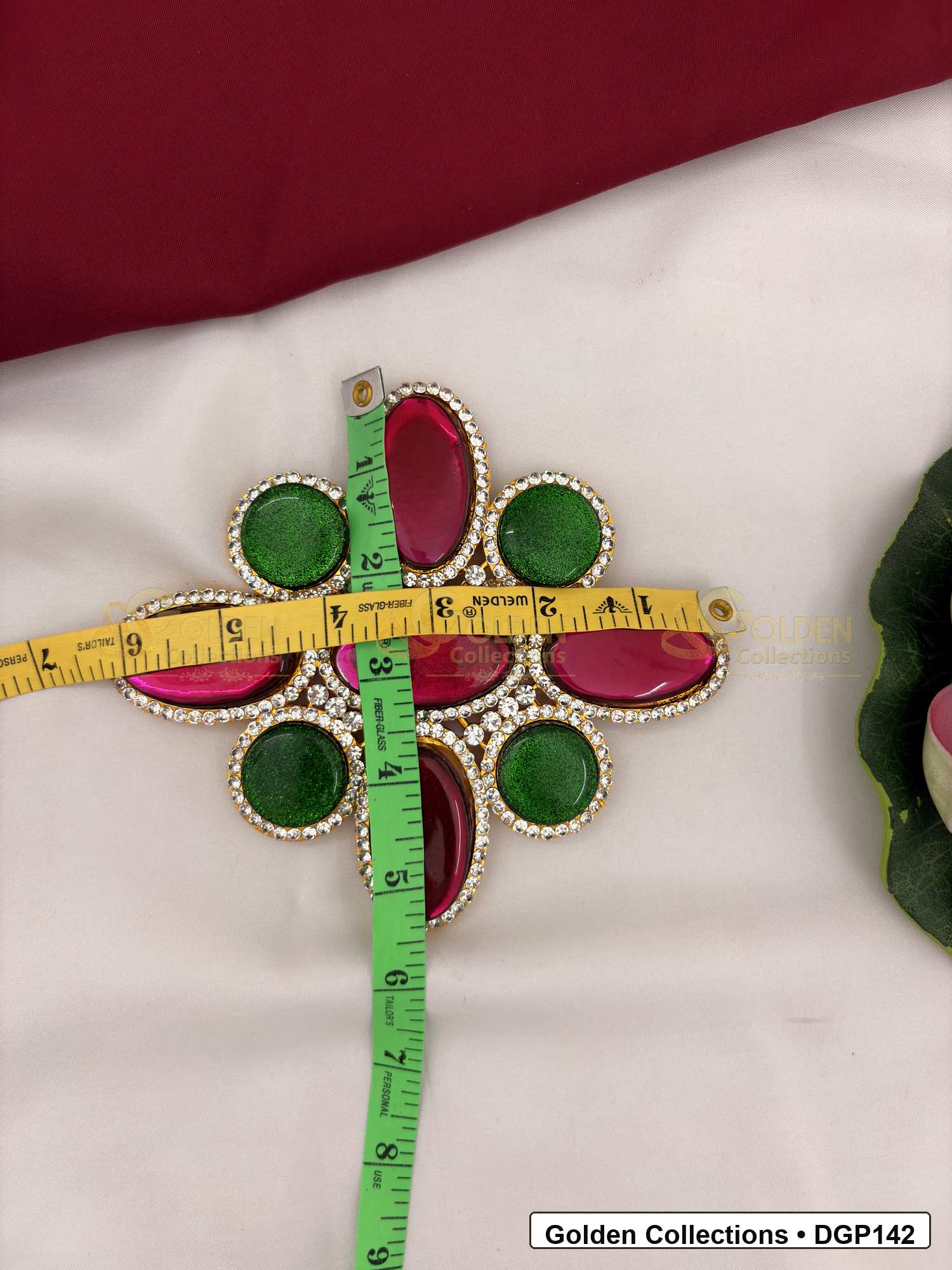Measurement photo showing 6.25 x 5.25 Inches oval stone deity pendant for idol alankaram with ruler for idol alankaram