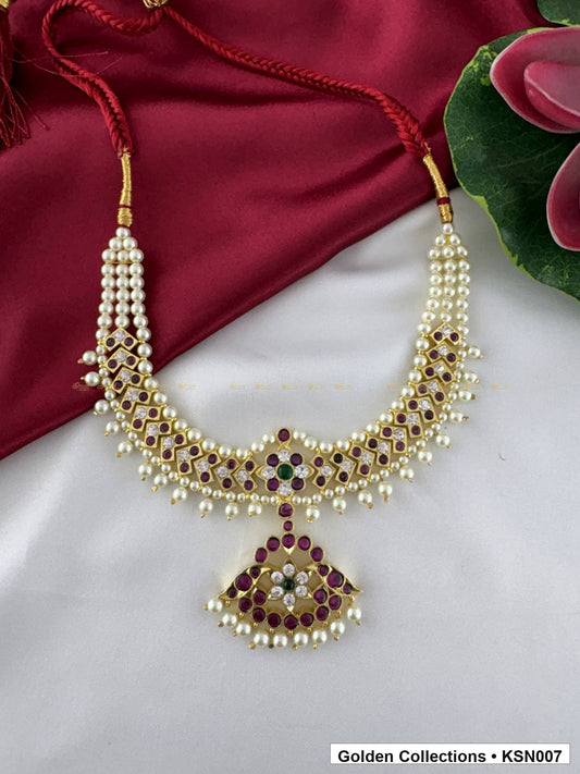 Front view of Pearl Border Real Kemp Short Necklace with Red Stones from Golden Collections