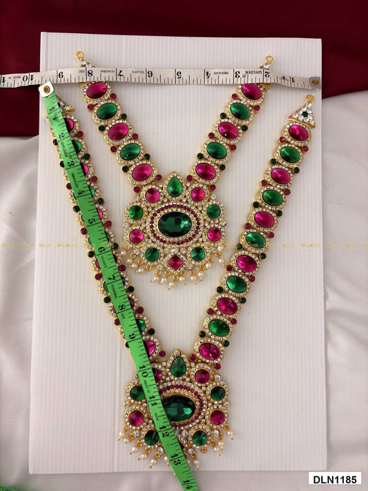 Front view of deity long haram set with multicolor stones and gold plating for idol alankaram