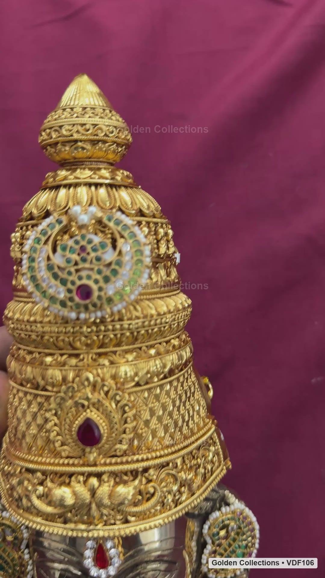 Fully decorated brass Varalakshmi face with green Jadau earrings shown in product video