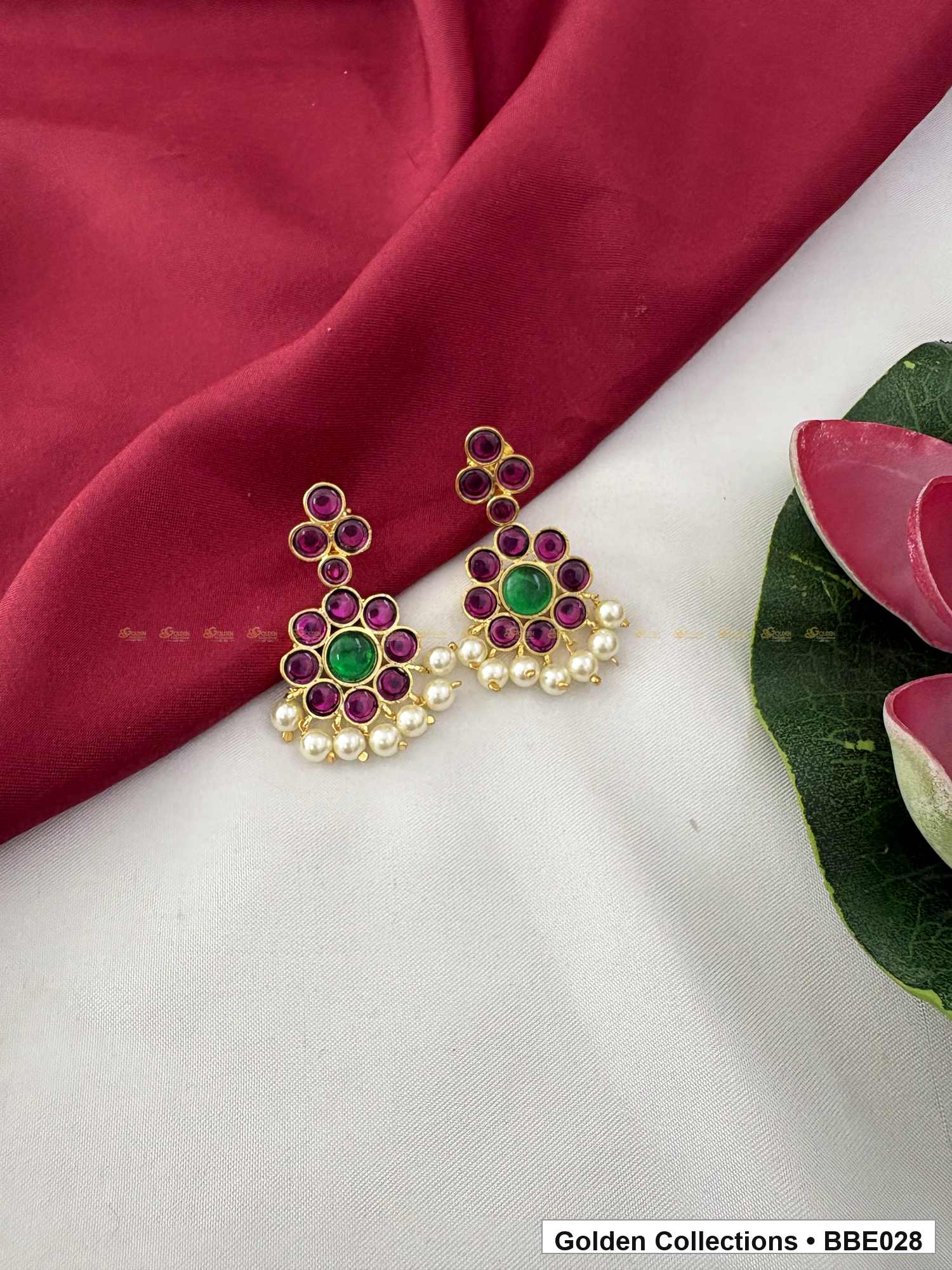 Angled product view of Red Green Stone Real Kemp Jhumki Earrings from Golden Collections
