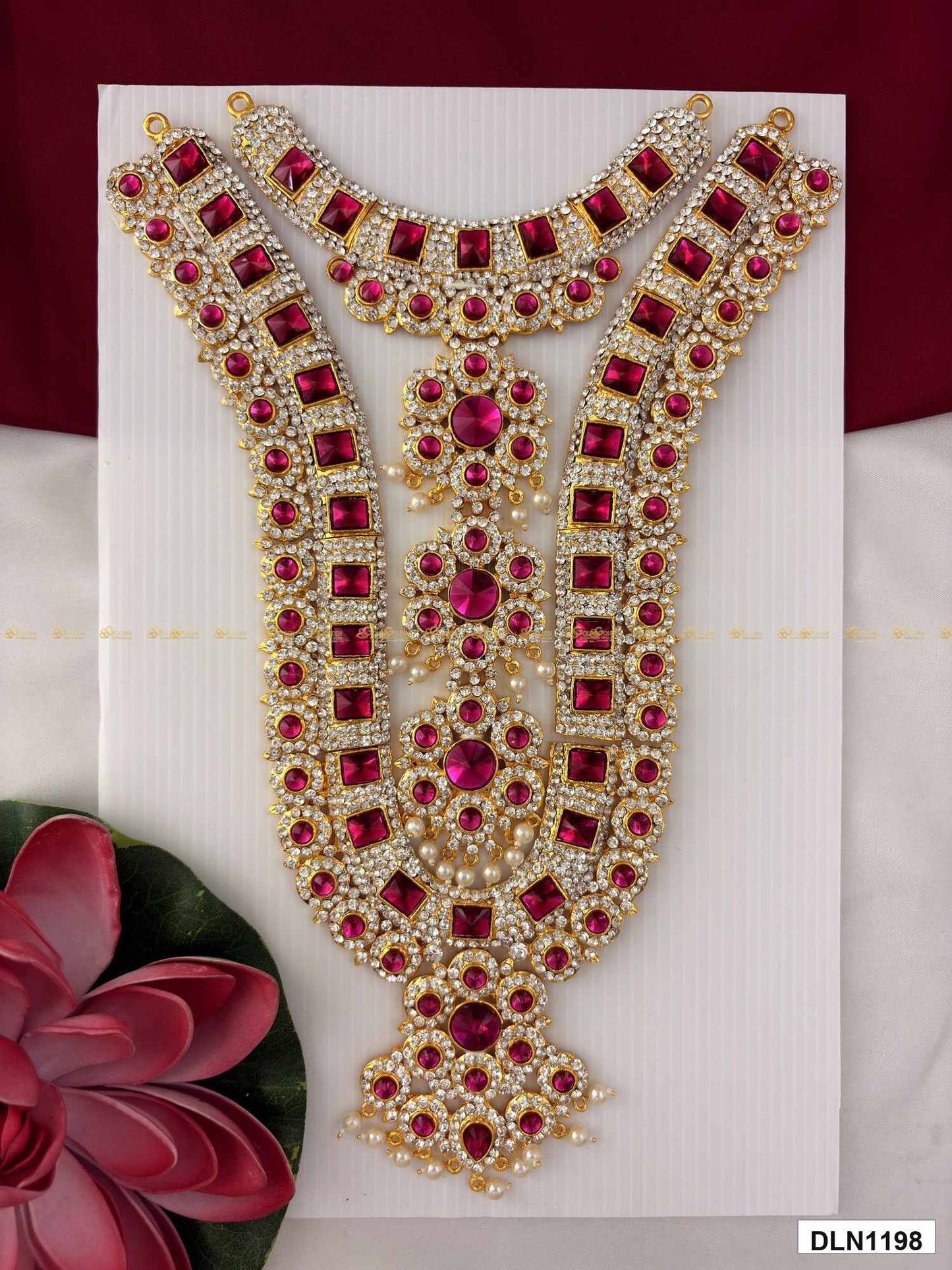 Front view of deity chest long haram with multicolor stones and gold plating for idol alankaram