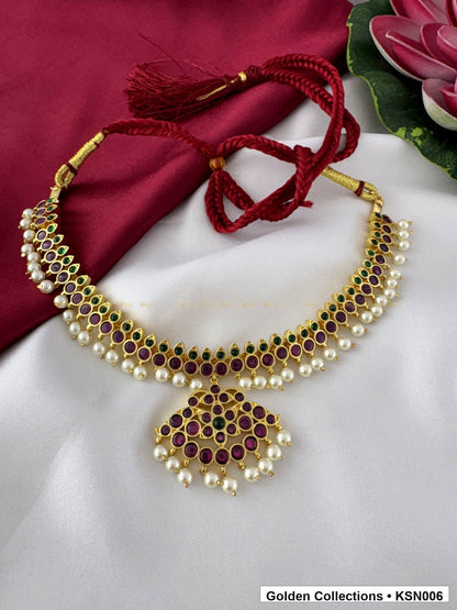 Angled product view of Red Stone Real Kemp Crescent Necklace with Pearl Border from Golden Collections