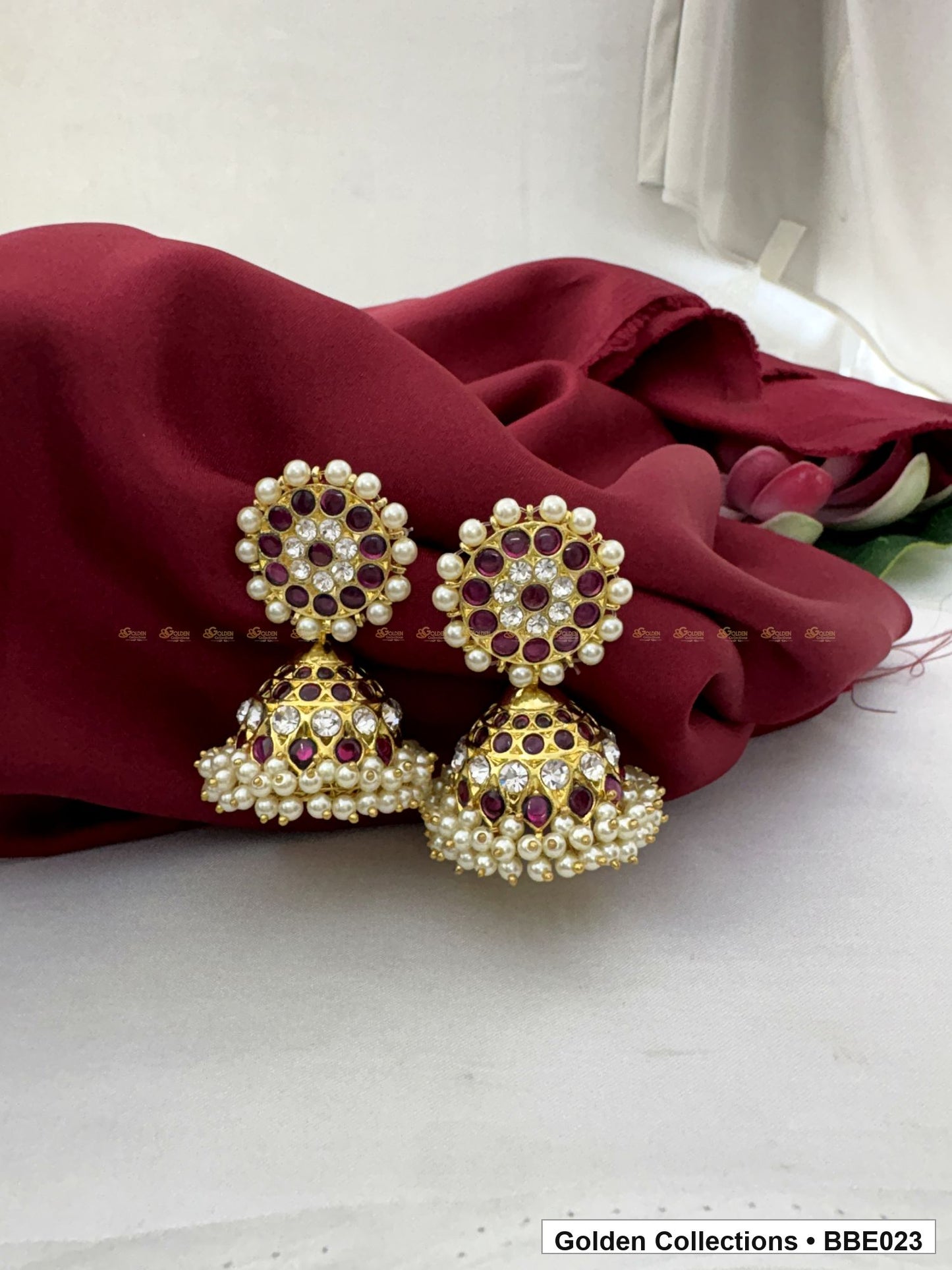 Front view of Red Stone Real Kemp Dome Jhumki Earrings from Golden Collections