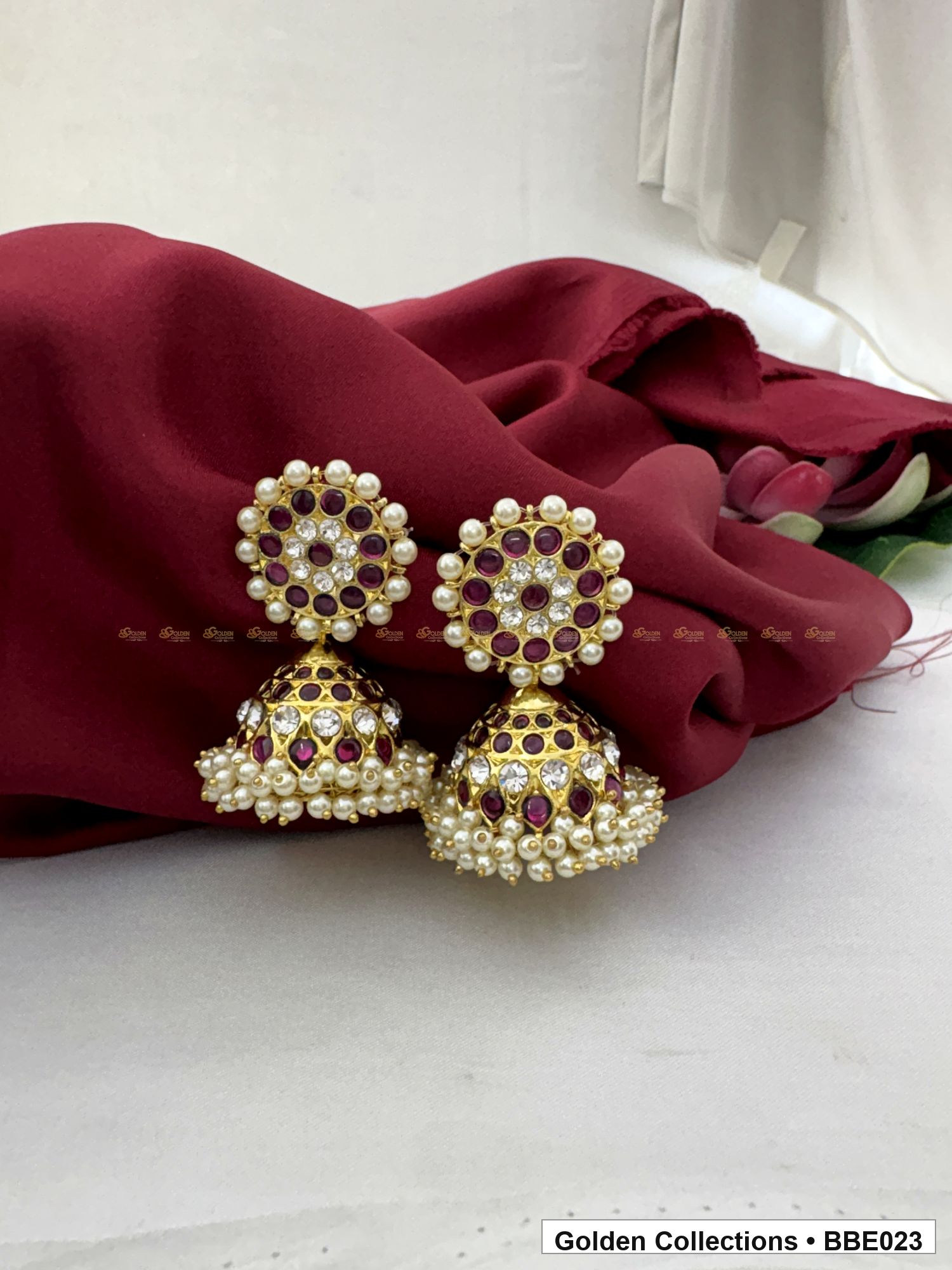 Front view of Red Stone Real Kemp Dome Jhumki Earrings from Golden Collections