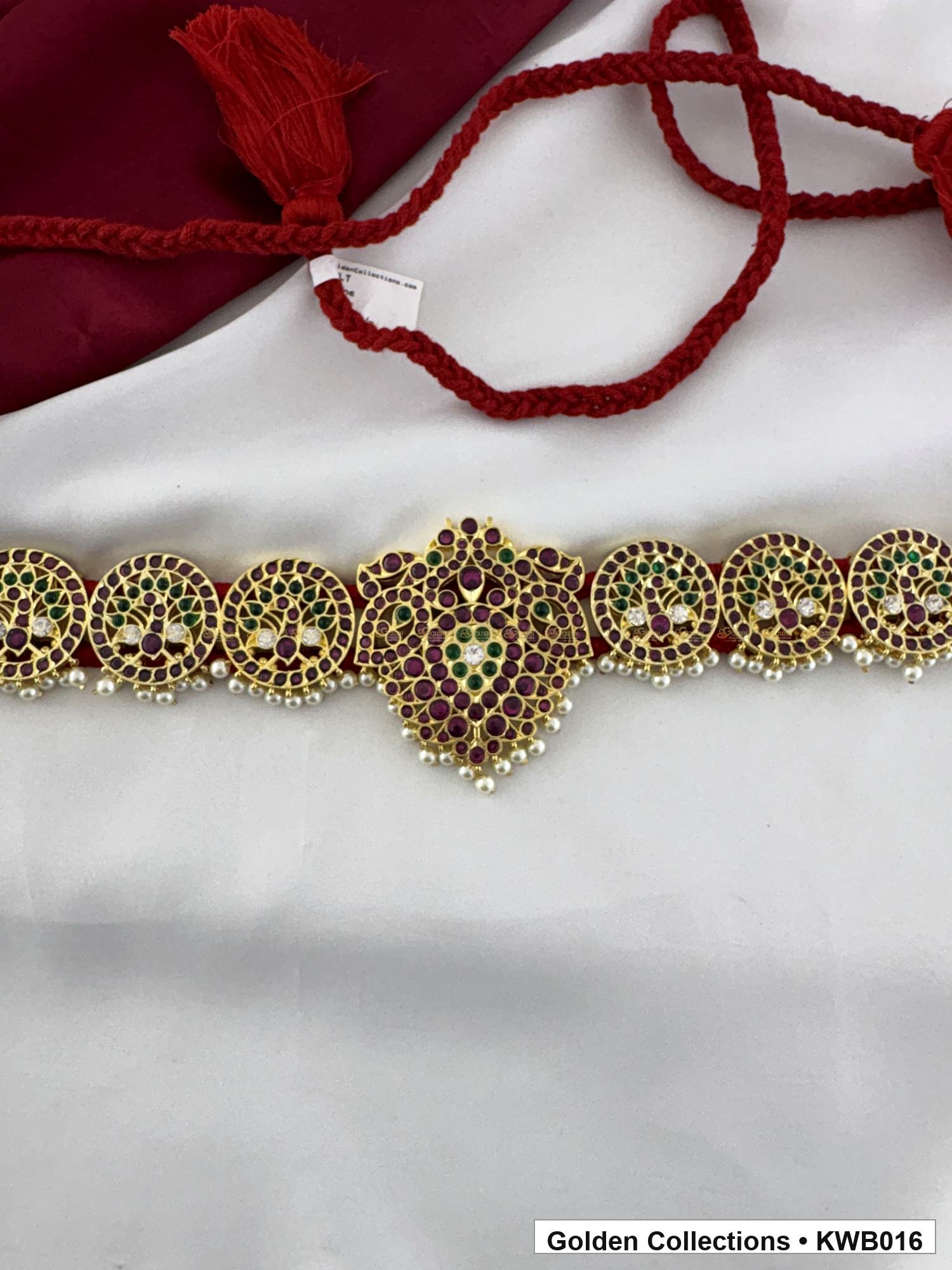 Angled product view of Red Stone Real Kemp Vaddanam Waist Belt with Center Pendant from Golden Collections