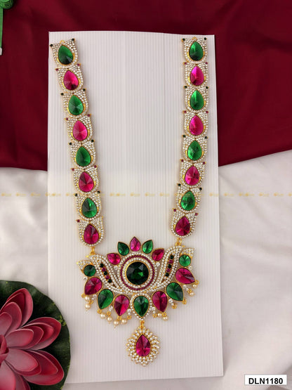Front view of deity long haram with multicolor stones and gold plating for idol alankaram