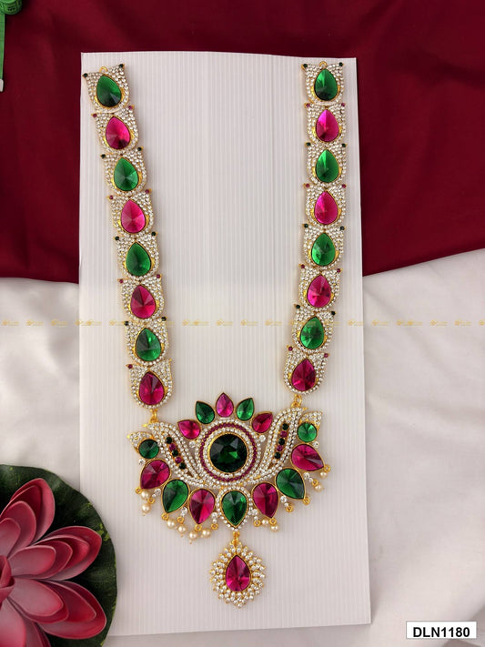 Front view of deity long haram with multicolor stones and gold plating for idol alankaram