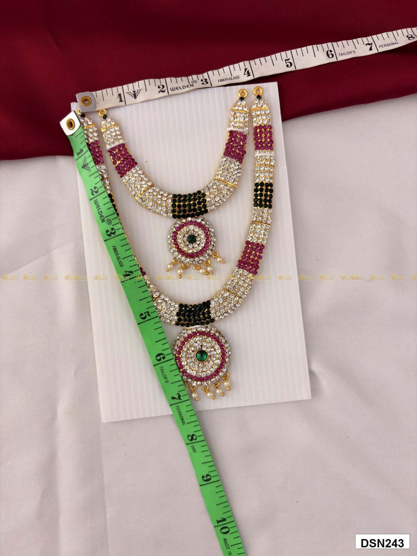 Measurement photo of deity short haram with measuring tape for idol alankaram size reference