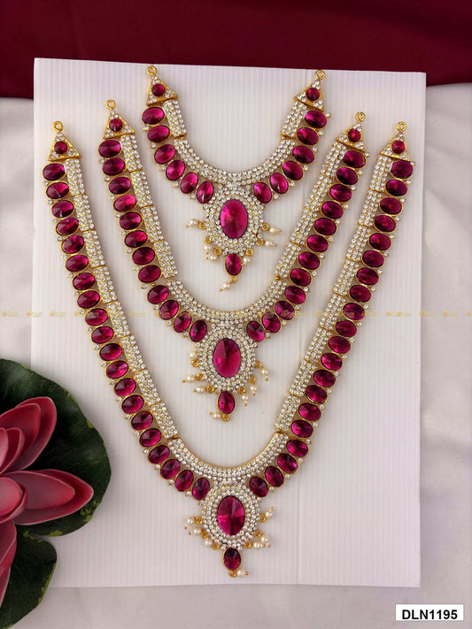 Front view of deity long haram set with multicolor stones and gold plating for idol alankaram