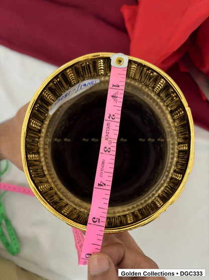 Opening measurement view of scroll medallion full-round brass deity crown with red green accents, measured size 13 X 16.5 X 5