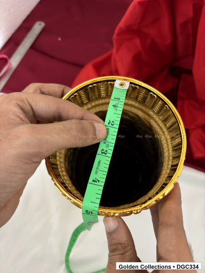 Opening measurement view of scroll medallion full-round brass deity crown with red green accents, measured size 11 X 15.5 X 4.5
