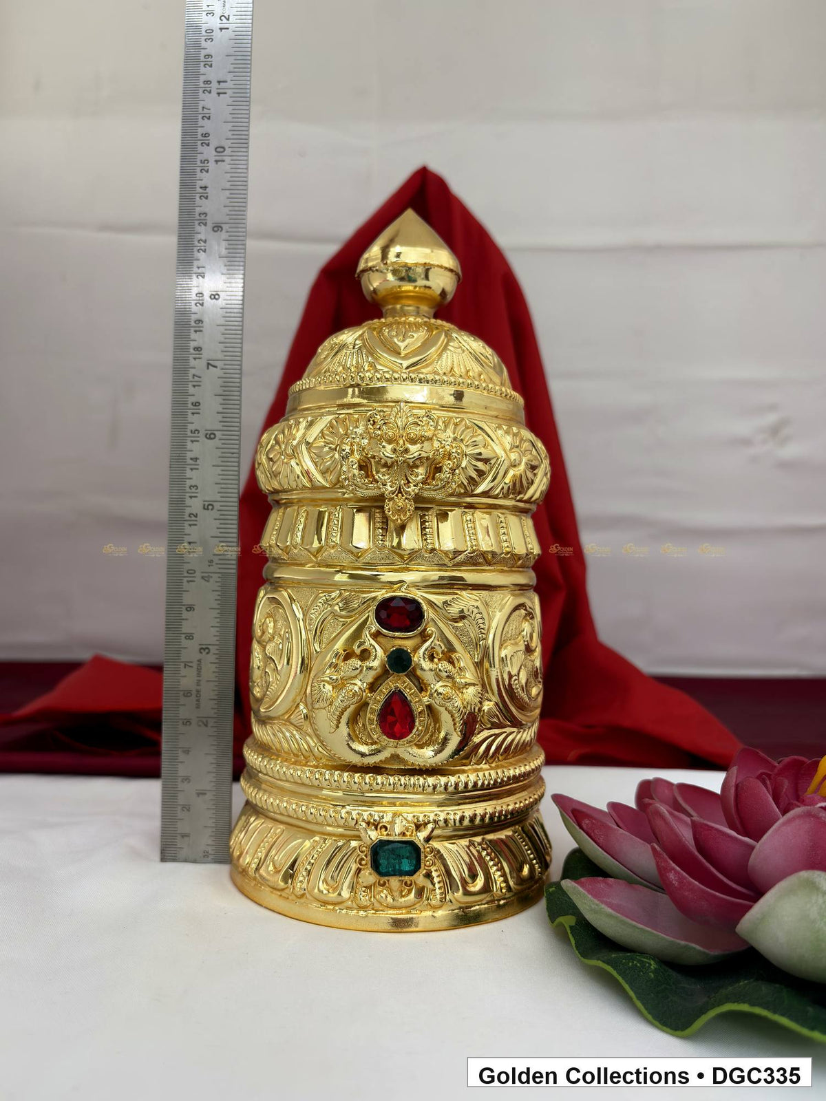 Height measurement view of scroll medallion full-round brass deity crown with red green accents, measured size 9.5 X 13.5 X 4