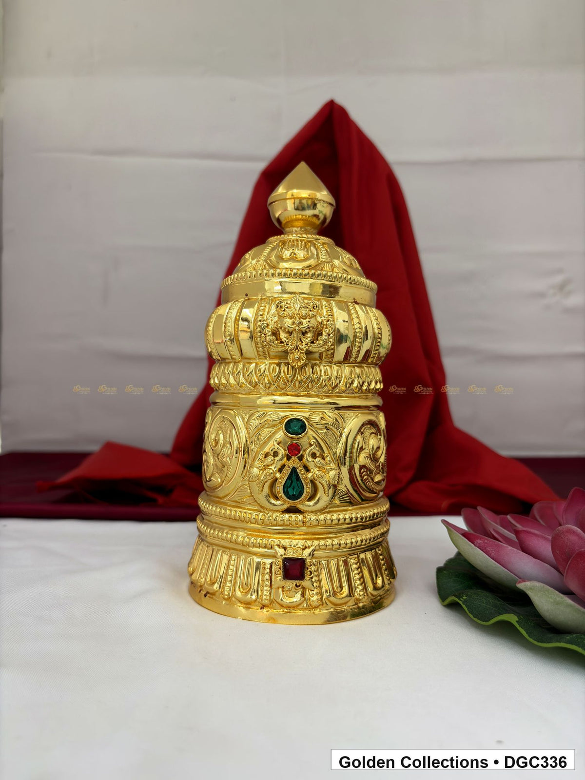 Front view of scroll medallion full-round brass deity crown with red green accents, measured size 8.7 X 12 X 3.7