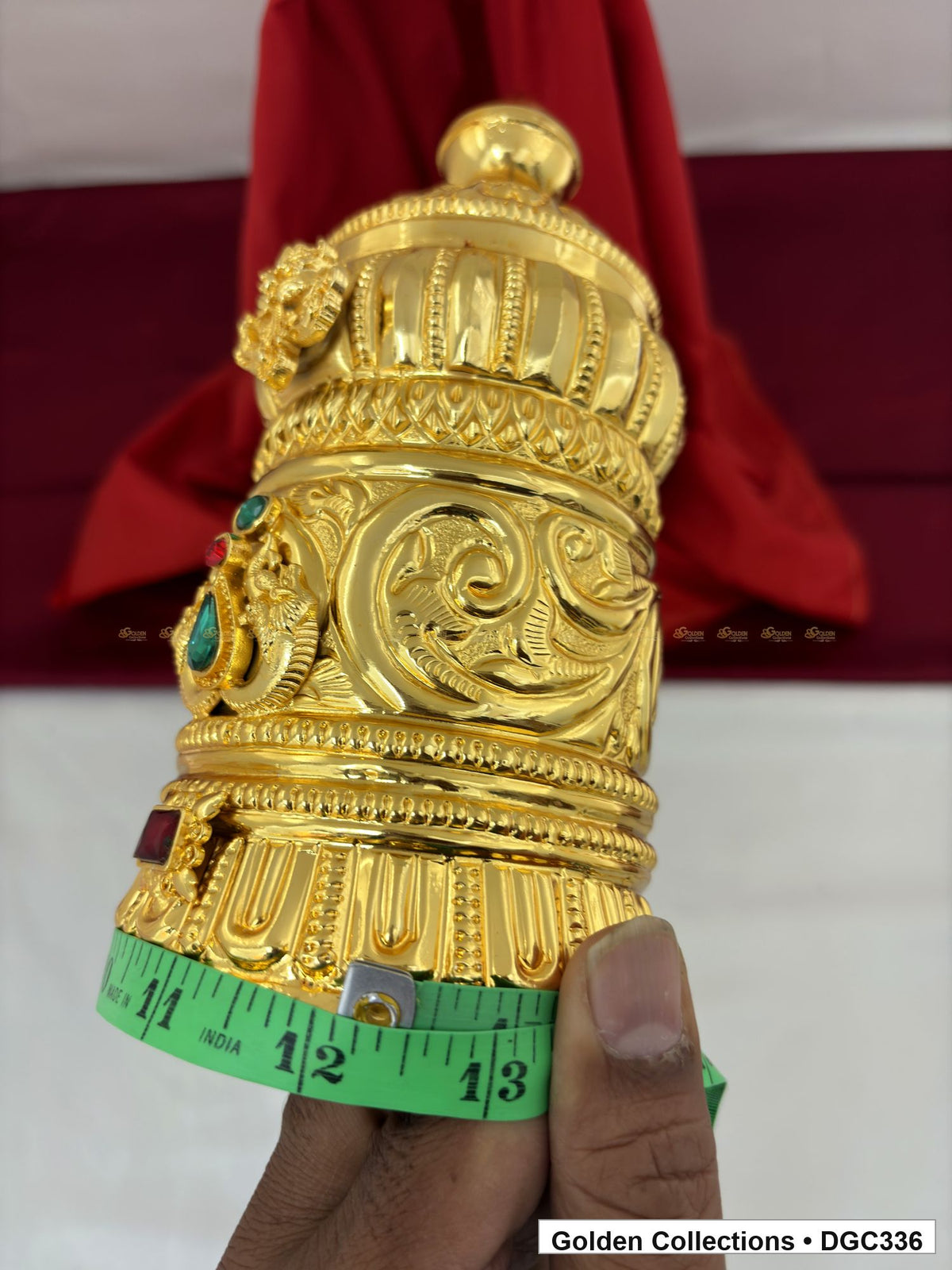 Opening measurement view of scroll medallion full-round brass deity crown with red green accents, measured size 8.7 X 12 X 3.7