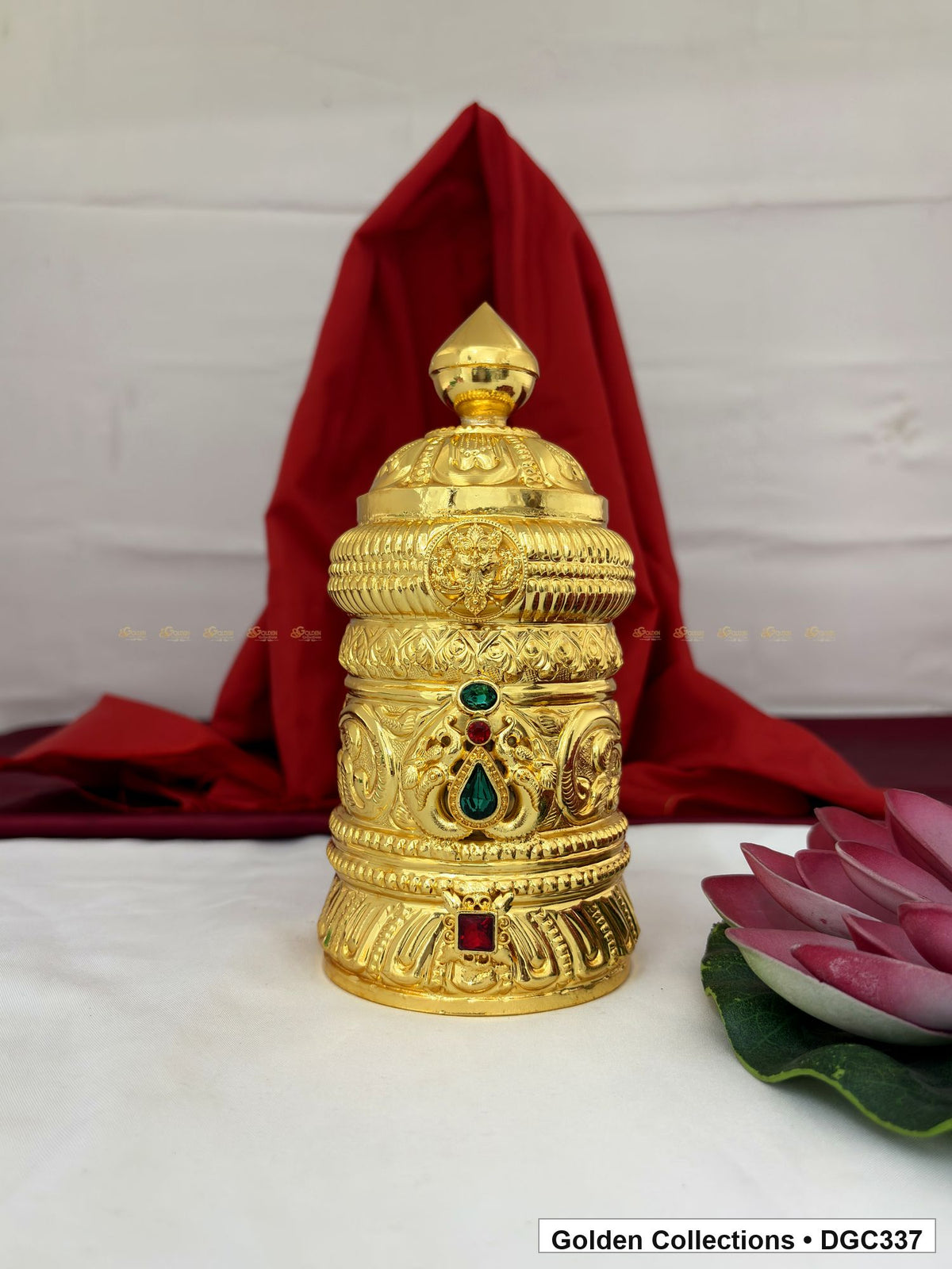Front view of scroll medallion full-round brass deity crown with red green accents, measured size 7.5 X 10.5 X 3