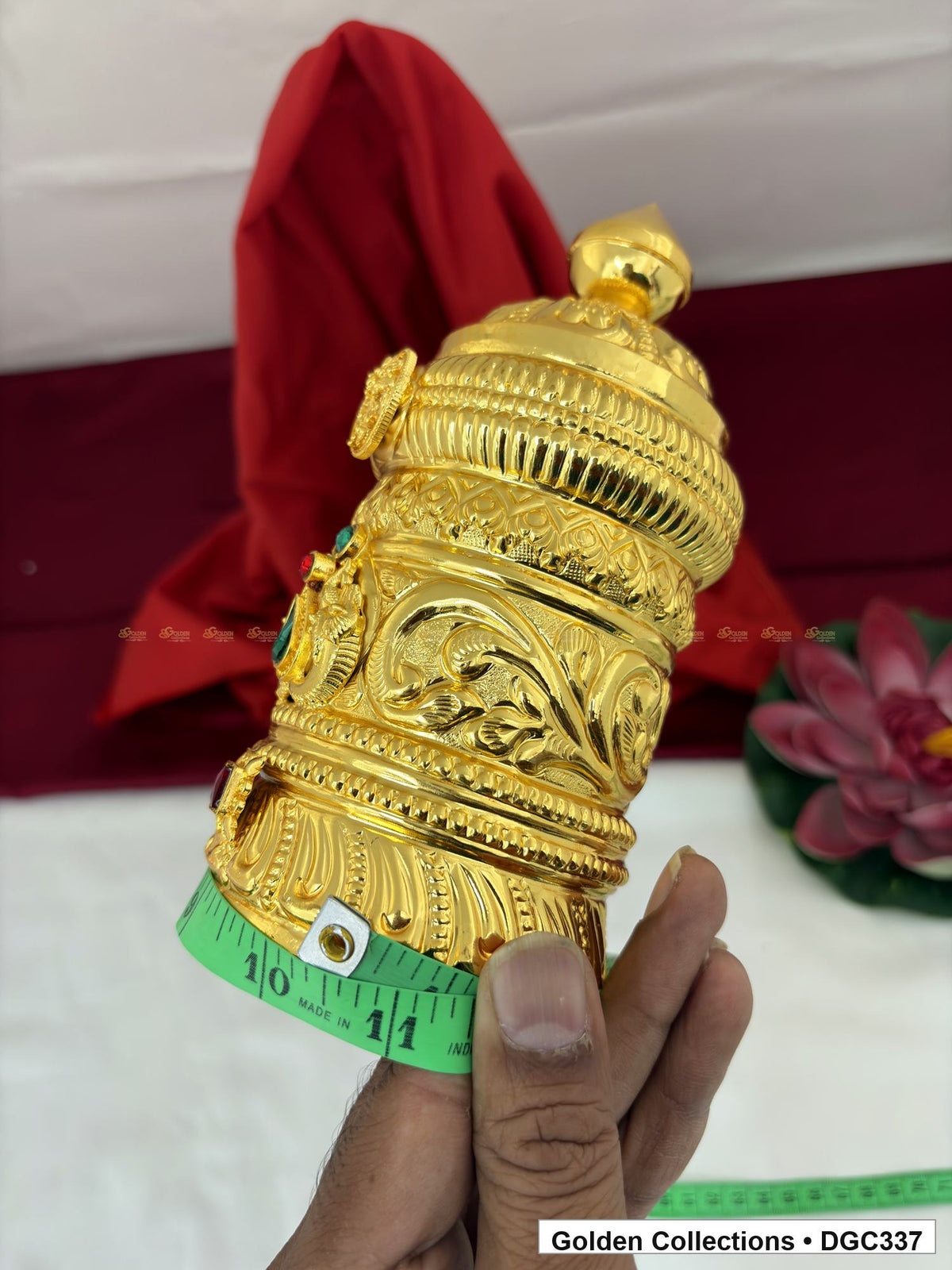 Side and base measurement view of scroll medallion full-round brass deity crown with red green accents, measured size 7.5 X 10.5 X 3