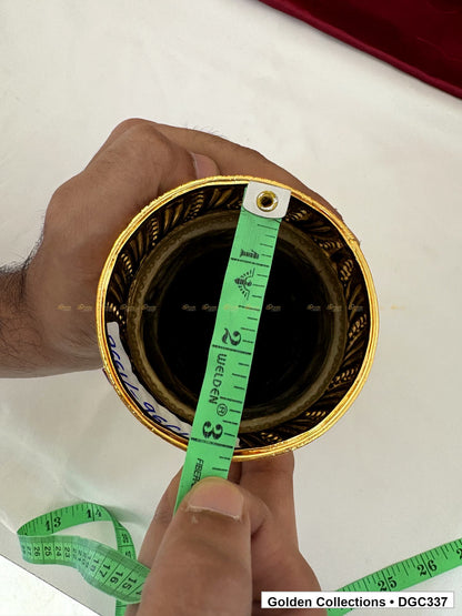 Opening measurement view of scroll medallion full-round brass deity crown with red green accents, measured size 7.5 X 10.5 X 3