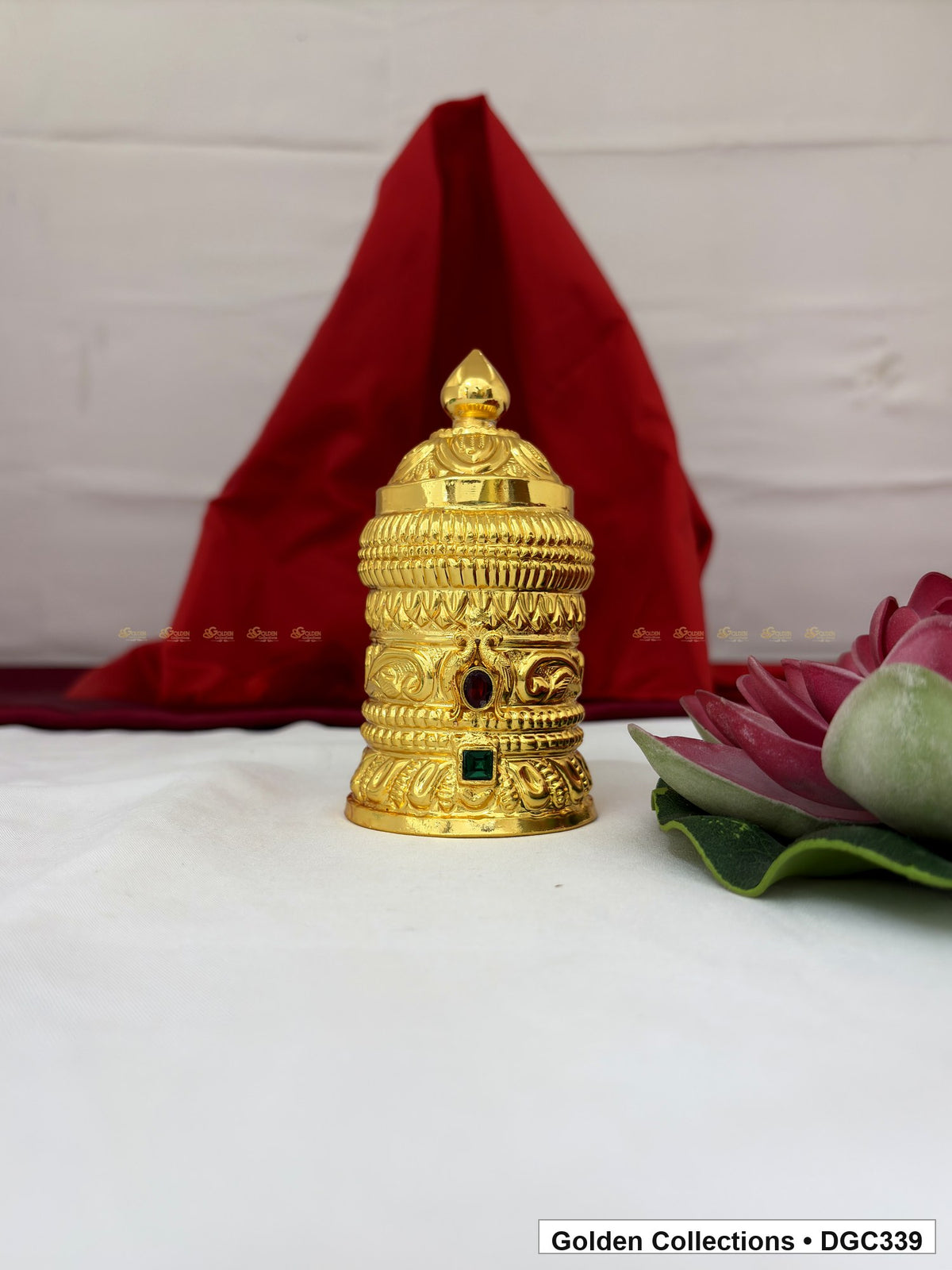 Front view of scroll medallion full-round brass deity crown with red green accents, measured size 4.7 X 7.5 X 2.25