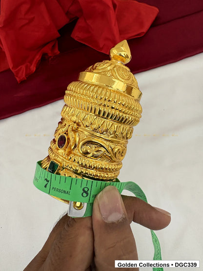 Height measurement view of scroll medallion full-round brass deity crown with red green accents, measured size 4.7 X 7.5 X 2.25