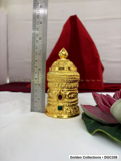 Opening measurement view of scroll medallion full-round brass deity crown with red green accents, measured size 4.7 X 7.5 X 2.25