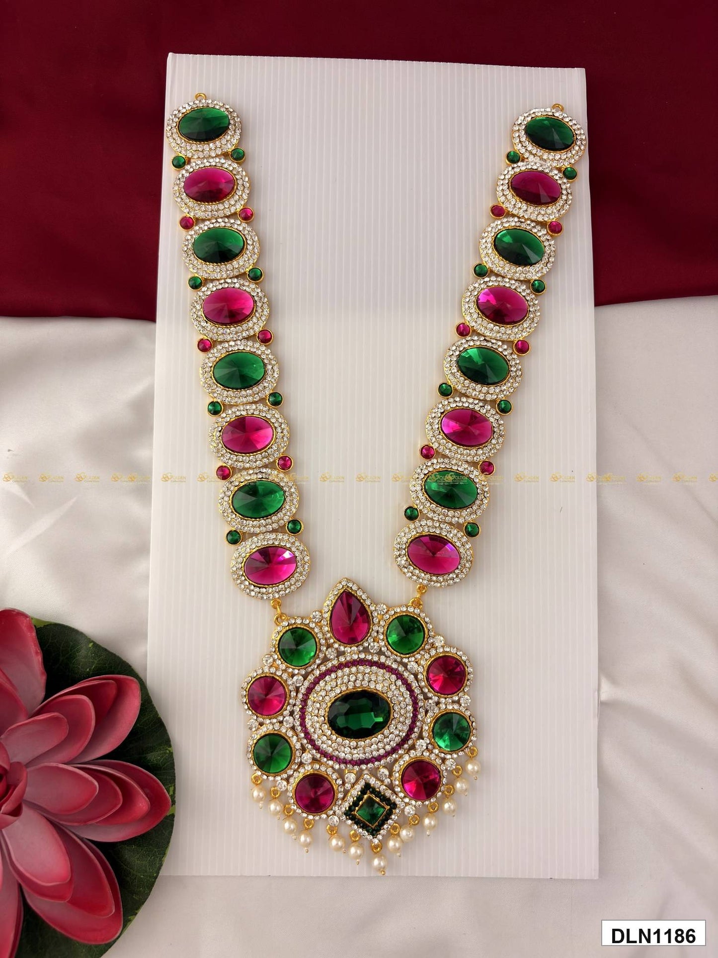 Front view of deity long haram with multicolor stones and gold plating for idol alankaram