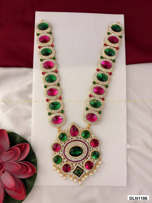Front view of deity long haram with multicolor stones and gold plating for idol alankaram