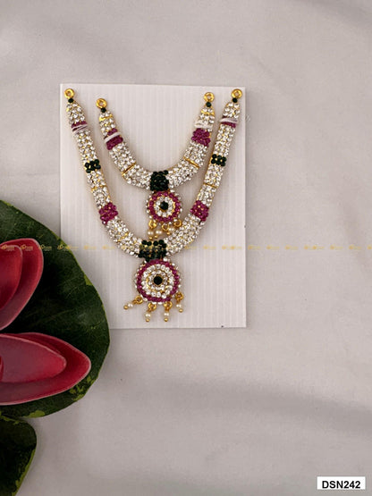 Front view of deity short haram with multicolor stones and gold plating for idol alankaram