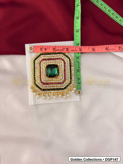 Measurement photo showing 4 x 3.5 Inches square green stone deity pendant for idol alankaram with ruler for idol alankaram
