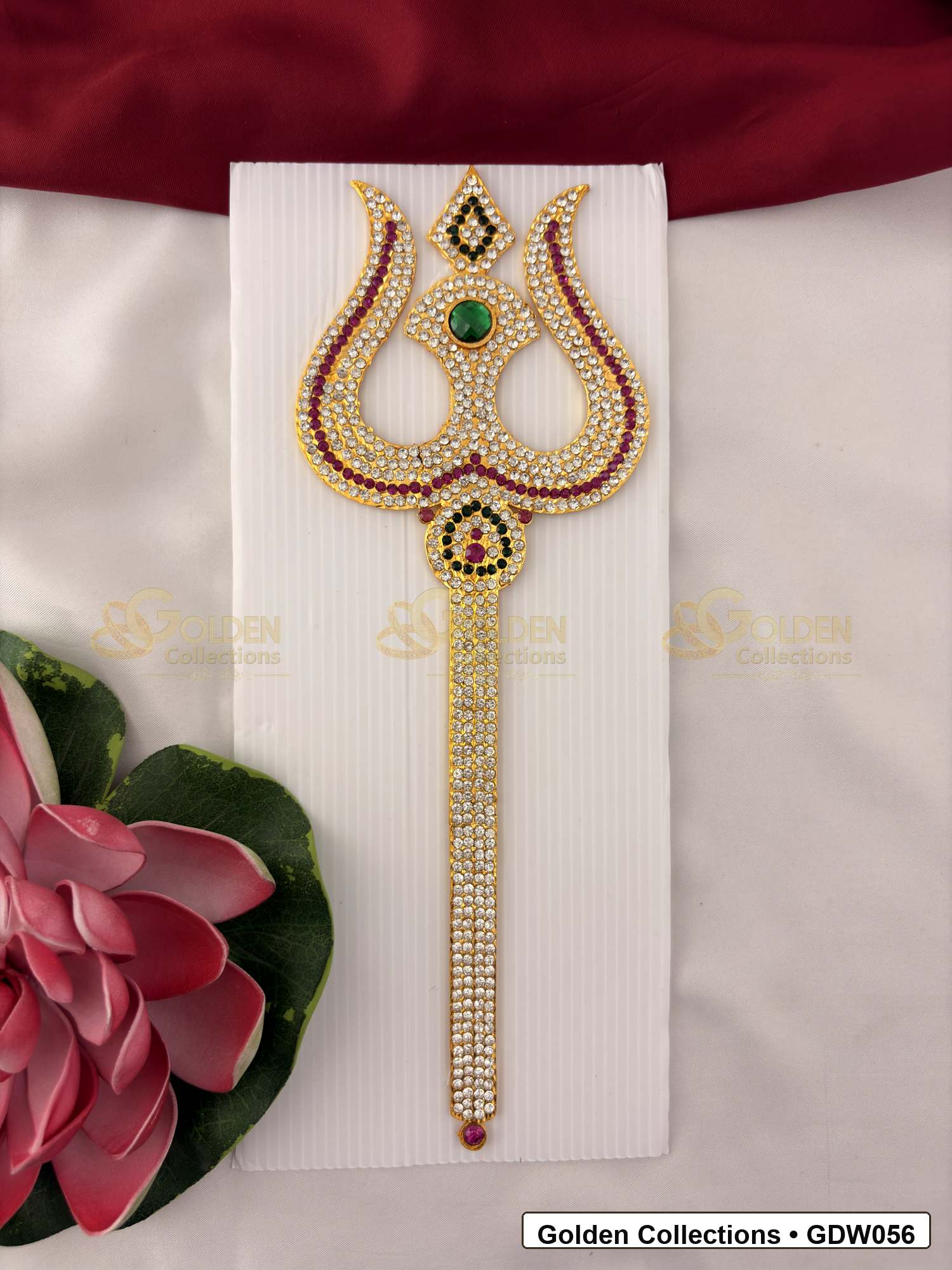 Stone Work Trishul for Idol Alankaram front view showing ornate trishul accessory with gold-tone handle, red, green and clear stone work, and pearl-style bead border for idol alankaram
