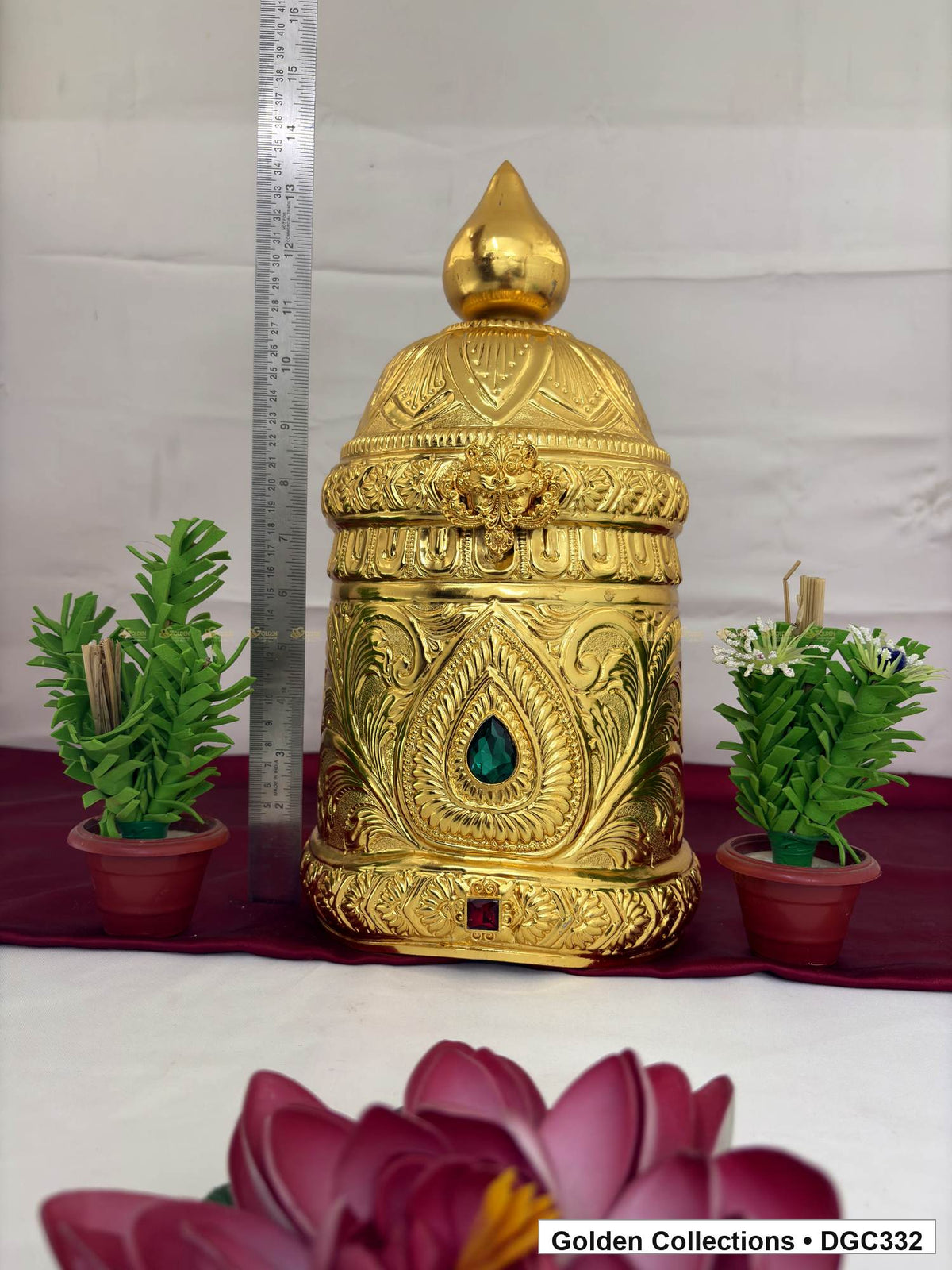 Height measurement view of teardrop medallion full-round brass deity crown with red green accents, measured size 15 X 23 X 7
