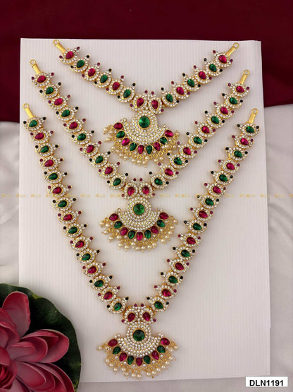 Front view of deity long haram set with multicolor stones and gold plating for idol alankaram
