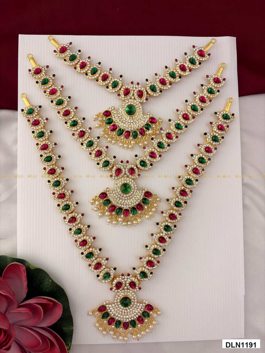 Front view of deity long haram set with multicolor stones and gold plating for idol alankaram